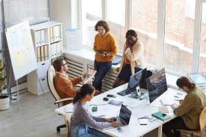 A picture of a group of people working in an office